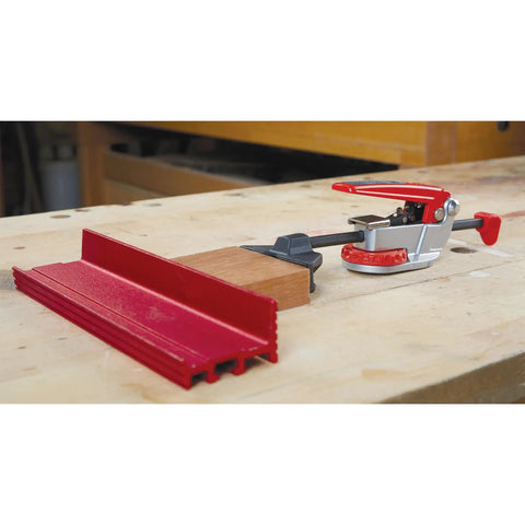 Auto Adjust In Line Dog Clamp For Woodworking With Split Dog Peg And Steel Push Rod Fits 20mm Or Three Quarter Inch Dog Holes Effortless Clamping And Stable Pressure No Fuss Readjustment Heavy Duty Bench Clamp P7 IL in use on woodworking bench.