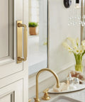 Ladera 5-1/16 Inch Center-To-Center Rectangle Champagne Bronze Cabinet Pull Backplate installed on kitchen cabinet