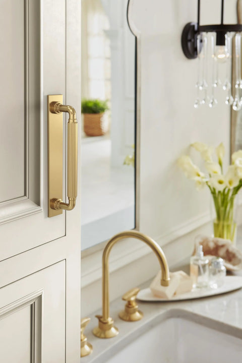 Ladera 5-1/16 Inch Center-To-Center Rectangle Champagne Bronze Cabinet Pull Backplate installed on kitchen cabinet
