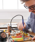 Pro Grade Soldering Iron Tip Cleaner Kit With Non Slip Cleaning Wire Ball And Base Holder in use on electronics assembly desk