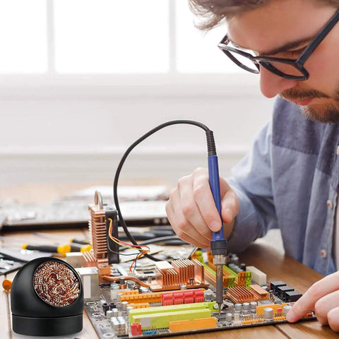 Pro Grade Soldering Iron Tip Cleaner Kit With Non Slip Cleaning Wire Ball And Base Holder in use on electronics assembly desk