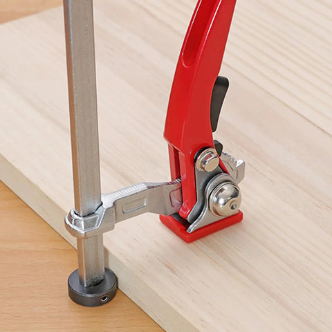 Hold Down Clamp With Quick Acting Ratchet For Woodworking Benches, red handle, alloy steel and zinc alloy, mounted on wood