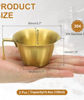 2 Pack Stainless Steel Espresso Measuring Cups With Handle, V Shaped Mouth, Spout, And Scale, 3.4 Oz 100 Ml, Gold Finish in hand