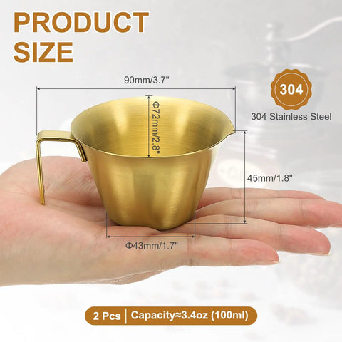 2 Pack Stainless Steel Espresso Measuring Cups With Handle, V Shaped Mouth, Spout, And Scale, 3.4 Oz 100 Ml, Gold Finish in hand