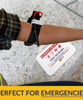 MFASCO Stop The Bleed 10-piece bleeding control kit with tourniquet, shown on forearm with white packaging tag