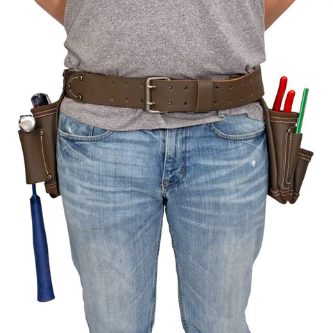 Person wearing Heavy Duty Leather Tool Apron With Seven Pockets, Hammer Holder And Rivet Reinforced Edges, full grain leather on waist
