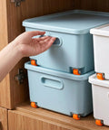 Top Shelf Heavy Duty Rubber Caster Wheels 4 Pack 0.5 Inch Low Profile Rollers Non Swivel Rigid Build For Smooth As Butter Furniture Glides Killer Fit For Under Bed Drawers And Cabinet Sliding Setup Bright Orange Set in use on blue storage bins