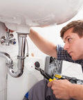 Plumber fixing sink with tool, using Heavy Duty Cleaning Wipes 260 Count Bulk Pack With Dual Texture For Hands And Surfaces Remove Paint