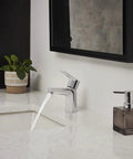 Bauloop Single Hole Bathroom Faucet With Single Handle S Size Chrome Finish 1.2 GPM Flow installed on a modern white vanity.