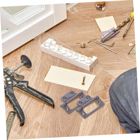 quiet heavy duty cabinet hinges lying on wooden floor with tools and materials for installation