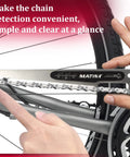 Hands using CC-4 Bike Chain Wear Gauge And Checker Tool For Quick And Accurate Chain Wear Readings on a bicycle chain.