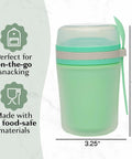 Double Wall Insulated Yogurt Container With Spill Proof For Real Lid Green Snack Cup holding a reusable spoon, 6.5 inches.