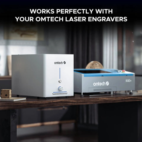 60W Fume Extractor for Laser Engravers With Heavy Duty Two Stage Air Filter System next to Omtech engraver on a table