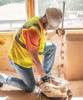 Worker using Tough As Nails 14 Inch Tool Bag With Detachable Shoulder Strap, 10 Interior Pockets For Hand Tool Organization.