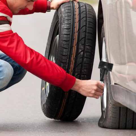 Man installing Spare Tire Hold Down Bolt Retainer Clamp For Cars And Trucks, Stays Put On Rough Roads And Keeps Spare Quiet