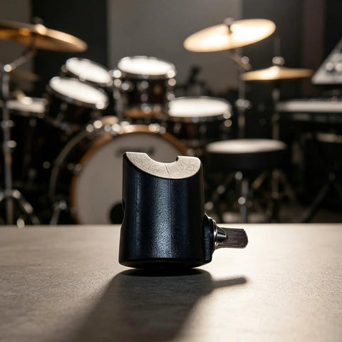 Super Secure Metal Electronic Drum Cymbal Stopper And Rotation Adjuster side view on a table in a drum studio setting.