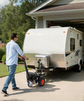 Man using VEVOR Electric Trailer Dolly Moves 3600 Lbs With Ease to maneuver RV trailer on driveway.