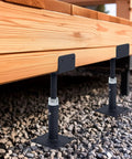 Heavy Duty U Shaped Floor Jacks 4 Pack Adjustable Steel Teleposts supporting a wooden deck framed with gravel.