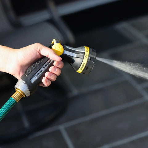 Close-up of RelaxGrip Metal Garden Nozzle With Multi Pattern Spray Arthritis Foundation Ease Of Use Certified in use spraying water