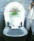 Slick Transparent Dolphin Toilet Seat Featuring Smooth Glide Soft Close Lid Cover And Built In Led Night Light with glowing edge.