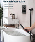 GRANDJOY Dual 12" Shower System with Handheld Spray, Matte Black showing handheld spray in use over a bathtub.