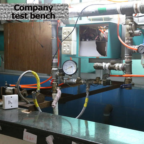 Industrial test bench with pipes, gauges, and electrical components for testing Ultra Compact 10W Hydroelectric Generator.
