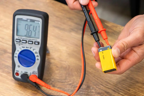 600V True RMS Auto Ranging Multimeter With Large Screen And Relative Mode used to test 9V battery voltage