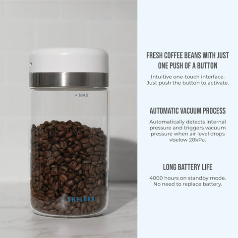 Keep Your Beans Fresh As A Daisy With This Smart Electric Vacuum Seal Coffee Canister And Airtight Storage Jar For Whole Ground Roasts Real Deal Smooth Push Button Operation Durable Borosilicate Glass with coffee beans inside.