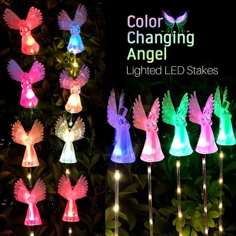 Solar Angel Lights Outdoor Decor Set Of 2 with fiber optic wings and color changing LED lights in a garden setting at night