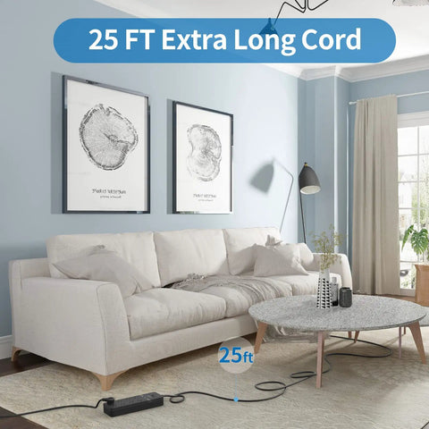 Living room with a 25 ft extension cord connected to a surge protector by the sofa and table, showing the Beefy 25 Ft Flat Plug Extension Cord With 8 Outlet Surge Protector And 4 USB Ports Including 2 USB C 15A Breaker Wall Mount Power Strip For Home Office Garage Black.
