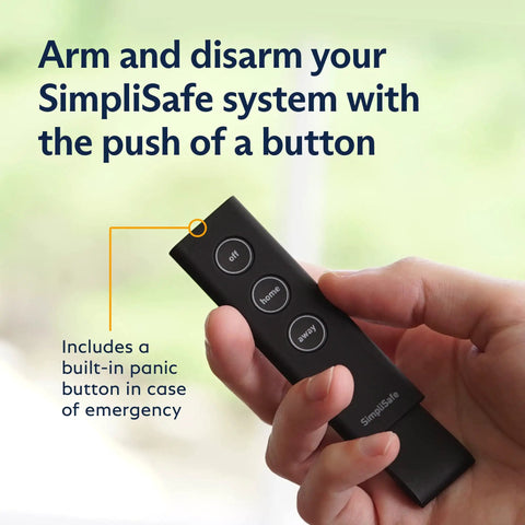 Hand holding remote control for 12 Piece Wireless Home Security System Kit With HD Camera, Optional 24 Seven Professional Monitoring