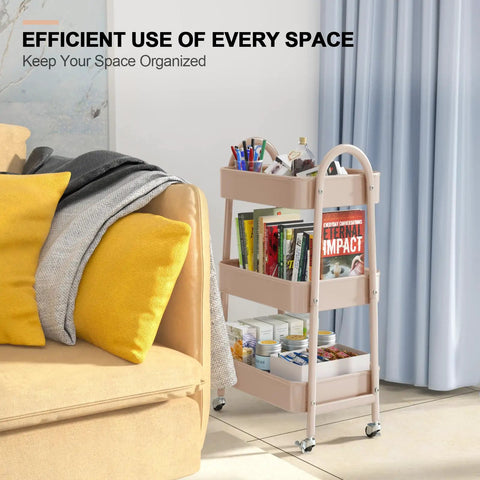 Three Tier Rolling Utility Cart With Lockable Wheels And Handy Metal Handle, Metal Storage Organizer On Wheels With Mesh Baskets For Kitchen, Living Room, Office Or Garage Beige Finish next to a beige sofa.