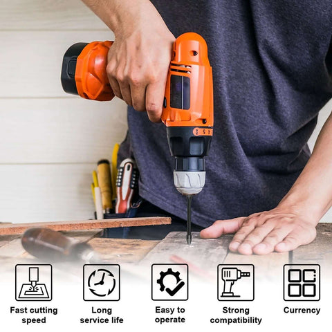 Front view of an orange cordless drill with bit installed drilling into a wooden board on a workbench; tools in background.