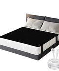 Grounding Bed Mat For Sleep And Recovery 54x78 Inch on bed with connectors, carbon fiber PU leather surface visible