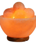Fire Bowl Salt Lamp With Crystal Massage Balls Handcrafted From Pakistan, warm amber glow in Himalayan salt crafted bowl on wooden base.