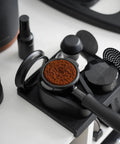 Top Shelf 58mm Espresso WDT Tool Featuring 16 Concentric Needles And Rock Solid Magnetic Base For Hella Even Puck Distribution Adjustable Depth Coffee Needle Stirrer Totally Nailing Shots Daily with coffee grounds ready for use.