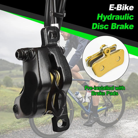 Black four-piston e-bike hydraulic disc brake caliper with pre-installed gold brake pads