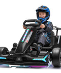 Smiling child driving Electric Drift Go Kart For Kids 6 And Up With 24V 800W Power And 8.2 MPH Top Speed, EVA Tires, lit rainbow lights.