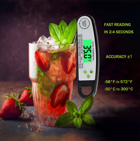 Digital Meat Thermometer For Grilling With Backlit Display, Instant Read In 2 To 4 Seconds next to a glass of strawberry mint drink