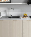 Modern kitchen with Matte Black Cabinet Pulls 5 Inch Finger Edge 128mm Center to Center 30 Pack installed on light wood cabinets