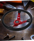 Deep Dish 14 Inch PU Racing Steering Wheel with Red Horn Button on wooden table among tools