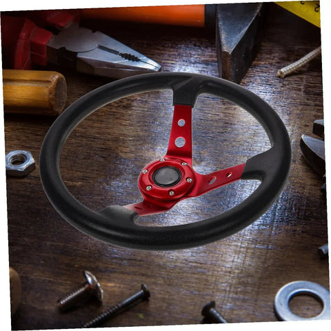 Deep Dish 14 Inch PU Racing Steering Wheel with Red Horn Button on wooden table among tools