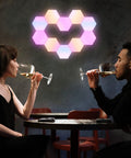 Lit Smart Hexagon LED Light Kit, 10 Pack WiFi Wall and Tabletop Blocks illuminated in a heart shape, mounted on a wall