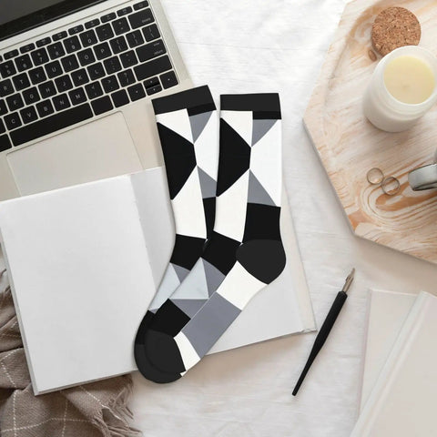 Fresh Black And White Grid Pattern Ankle And Crew Socks Men Women Unisex Athletic Daily Workout breathable on desk with notebook.