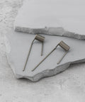 Heavy Duty Letterbox Hinge Springs With Flex Arms Dual Size Fit Premium Steel Construction, shown on gray stone surface.