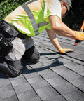 Worker wearing Heavy Duty Knee Pad Sleeves With Triple Layer Padding, Breathable Mesh Back, Elastic Cuff on a roof job site