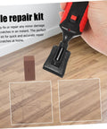 Hand using Floor Repair Kit With Quick Heating Wax Block Sponge For Laminate And Hardwood Floors And Tile Scratches Easy To Use