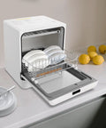 No Sweat Sleek Countertop Dishwasher Portable Electric Mini Washing Machine With Led Display and Rustproof Stainless Steel Interior quick rinse cycles for small apartments, showing dishes in rack.