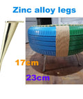 Heavy Duty Metal Furniture Legs Set 17cm zinc alloy sofa leg next to a repurposed tire stool on hardwood floor
