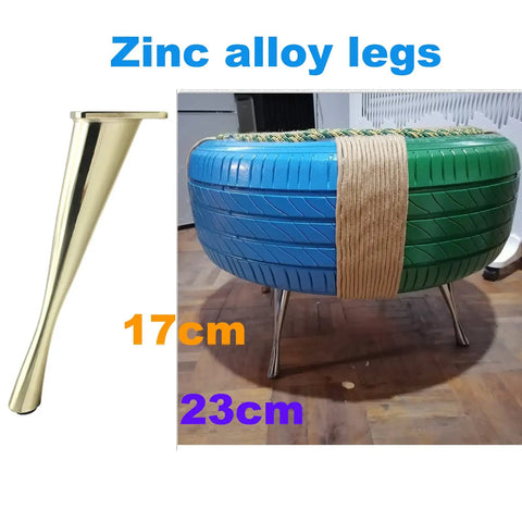Heavy Duty Metal Furniture Legs Set 17cm zinc alloy sofa leg next to a repurposed tire stool on hardwood floor